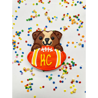 Sports Ball Buffet Cookies dog-themed cookie with a brown puppy and orange football
