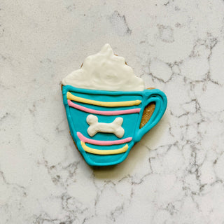 Dapper Breakfast Menu cookie shaped like turquoise mug with white bone decoration and whipped cream