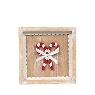 7x7 wood frame sign with candy cane motif and white ribbon bow on a rustic whitewashed background for Christmas decor