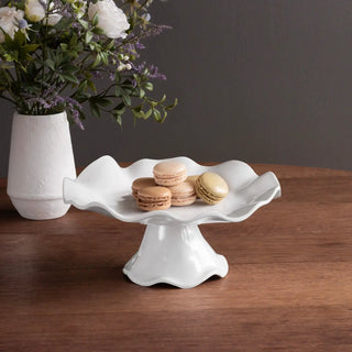Havana white pedestal cake plate with scalloped edge, holding five macarons