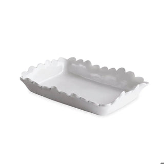 Guest towel holder in white ceramic with scalloped edges.