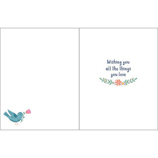 Birthday greeting card with envelope; left page shows a blue bird, right page Wishing you all the things you love.