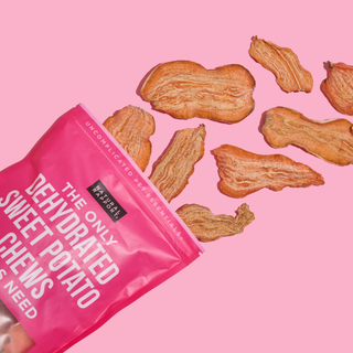 The Only Dehydrated Sweet Potato Chews for dogs in a pink snack pouch with scattered dried slices