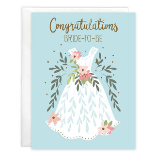 Wedding greeting card with envelope featuring a white wedding dress adorned with pink flowers on a light blue backdrop