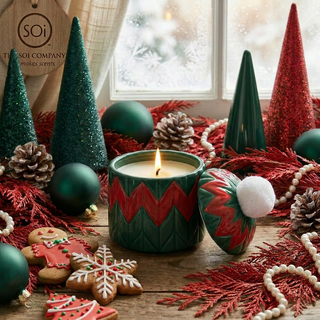 10oz hand-painted beanie candle in green with red zigzag pattern and white pom-pom lid