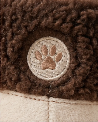 Apres Ski Boot dog toy, brown plush with beige paw patch.