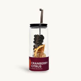 Cranberry Citrus Cocktail Infusion Kit in a clear glass jar with black lid; dried orange slices and dark berries