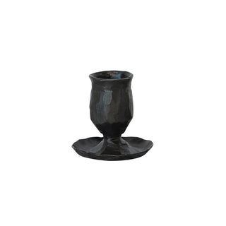 Hand-forged cast iron taper candle holder with a rugged hammered texture and dark black finish.