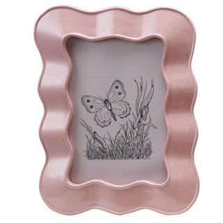 Set of four resin wavy photo frames for 4x6 photos by Creative Co-Op; pink, lavender, green, and white.