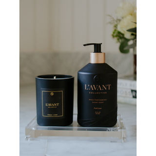 Lucite tray - Medium with two black containers (pump hand soap bottle and candle jar) on a marble surface