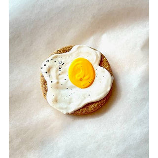 Breakfast Menu Dapper pet cookie with white icing and yellow yolk center