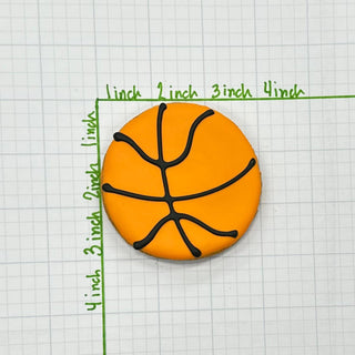 Sports Ball Buffet Cookies, orange basketball-shaped cookies with black icing lines