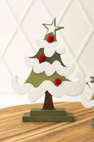 Wood Christmas tree ornament on a stand; green tree with white snow and red berries