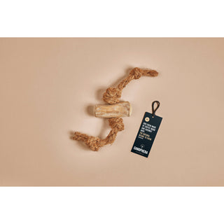 Dog chew toy made of coffee wood and natural coconut rope, knotted.