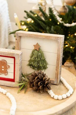 Two wood frame signs set; festive decor featuring a green tassel Christmas tree and a gingerbread figure, 7x7 inches