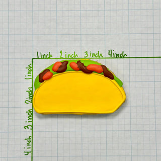 Lunch Menu Dapper cake with yellow fondant, green border, and orange-brown drizzle decorations