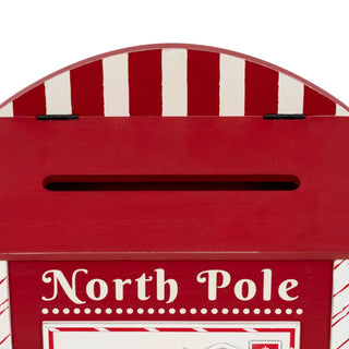 Red wooden mailbox Christmas decor with vertical white stripes and candy cane motif, 9x12 inches.