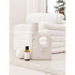 Laundry detergent Fresh Linen bottle with built-in white handle; two items shown including amber essential oil bottle.
