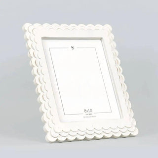 Wood scalloped photo frame in white for 8x10 photos, featuring a decorative border and clean inner edge.