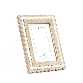 Two natural wood scallop-edge photo frames for 5x7 pictures with white inner borders.