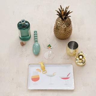 Enamelled kitchen tray, 12-3/4 by 7-3/4 in, white with colorful cocktail illustrations.