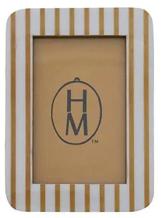 Resin striped photo frame in gold and white with an HM logo centerpiece