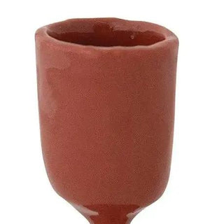 Enameled cast iron taper holder in red for home decor.