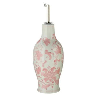 Handpainted stoneware oil cruet with pink floral pattern on a white base, metal pump.