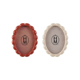 Set of two oval MDF scalloped photo frames in red and cream.