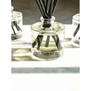 Reed diffuser Fresh Linen in a clear glass bottle with black reeds