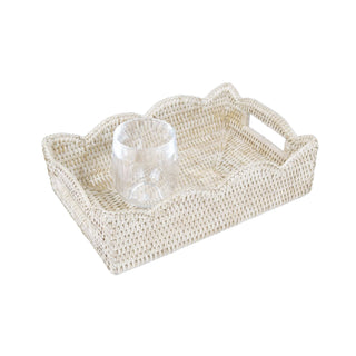 Small scalloped cream rattan tray with handles; handwoven and lacquered finish, with a clear glass
