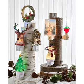 Animated Swirling Glitter Cardinal Night Light with birch trunks, lit deer head, snowman, and glowing Christmas tree.