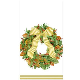 Guest towel napkin featuring a magnolia wreath with green leaves, red berries, and a gold striped bow.