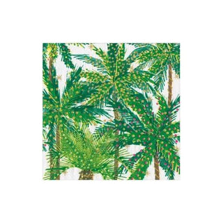 Cocktail napkin featuring green palm trees with string lights on a white background