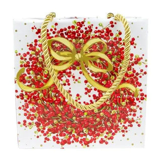 Pepperberry White small square gift bag with gold rope handles and a gold bow over red pepperberry clusters.