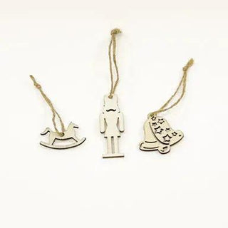 Set of three painted wooden nutcracker mini party crackers hanging by twine: soldier, rocking horse, and star-boot.