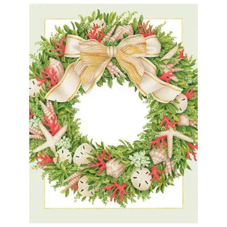 Seashell wreath on a framed holiday card with green foliage, starfish, red coral, and a gold ribbon bow