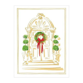 Boxed holiday cards featuring a gilded door foil, wreath with red ribbon, and green topiary pillars.