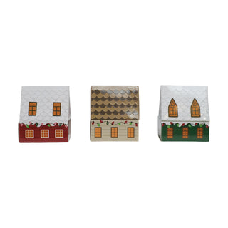 Safety matches in three house-shaped matchboxes; white/red, gold, and white/green roof designs with festive windows