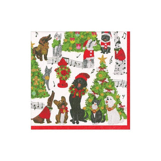 Paper cocktail napkin with Caroling Pets pattern featuring festive dogs and cats, Christmas trees, red border