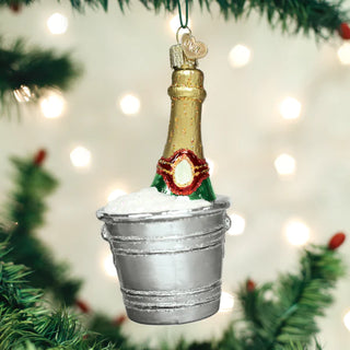 Chilled Champagne Ornament: gold bottle in a silver ice bucket with snow and holly accent