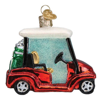 Glass golf cart ornament with red body, teal windshield and white roof.