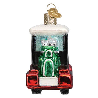 Golf cart ornament with red glittery body, white snowy roof, and a green glitter driver inside
